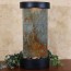 pines natural stone wall water fountain