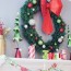red green and gold christmas mantel 2021