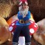garden gnome sitting on a mushroom