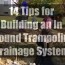 ground trampoline drainage system
