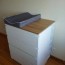 baby changing table with lots of