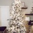 decorating a silver and gold christmas tree