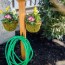 diy garden hose storage with plant