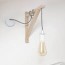 diy wall lamp with hanging lightbulb