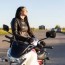 female motorcycle rider admiring the sunset